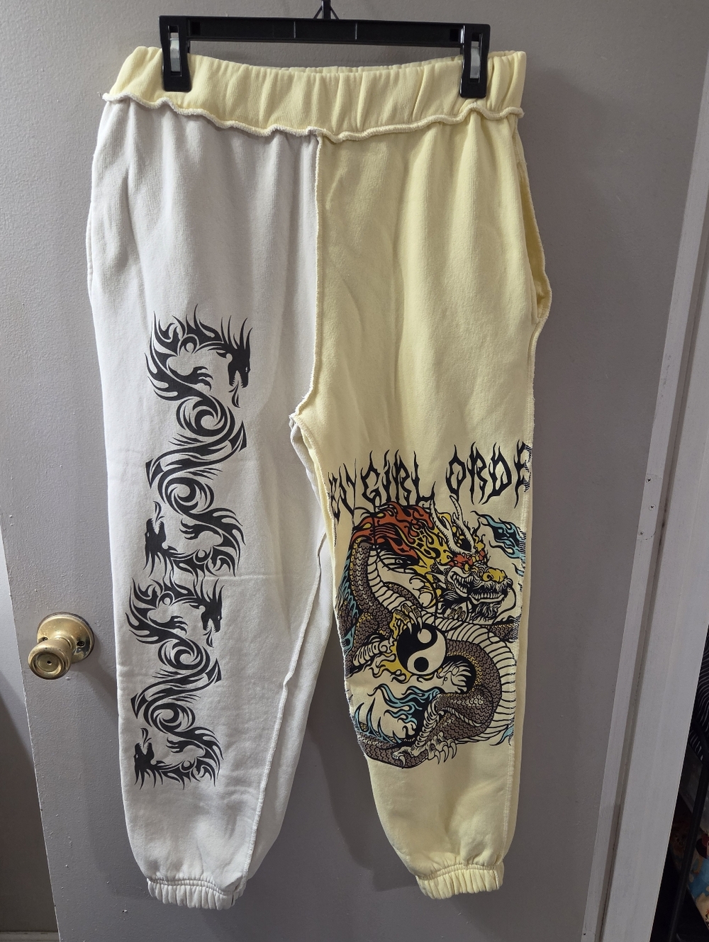 New Girl Order Dragon Graphic Two-Tone Sweatpants in Cream & Pale Yellow. Sz L